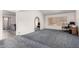 Spacious living area with neutral carpet and paint and multiple archways in this well maintained house at 2717 W Medina Ave, Mesa, AZ 85202