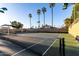 Enjoy a game on the community's tennis courts with lush greenery, palm trees, and well-maintained facilities at 2717 W Medina Ave, Mesa, AZ 85202