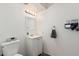 Cozy half bathroom featuring a single vanity, updated mirror, and fixtures at 3113 W Royal Palm Rd, Phoenix, AZ 85051