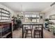 Open dining area with modern table and chairs next to a desk and shelves at 3113 W Royal Palm Rd, Phoenix, AZ 85051