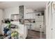 Well-lit kitchen featuring white cabinetry, updated countertops, and modern appliances in a cozy home at 3113 W Royal Palm Rd, Phoenix, AZ 85051