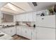 Bright kitchen showcasing ample cabinet space, laminate flooring, and modern appliances at 3113 W Royal Palm Rd, Phoenix, AZ 85051