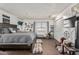 Comfortable main bedroom with a spacious layout, warm natural light, and carpeted flooring at 3113 W Royal Palm Rd, Phoenix, AZ 85051