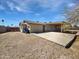 Spacious backyard with gravel landscaping, covered patio, and block fence for privacy at 3702 E Karen Dr, Phoenix, AZ 85032