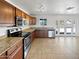 Updated kitchen showcasing stainless steel appliances, granite countertops and white walls at 3702 E Karen Dr, Phoenix, AZ 85032