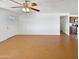 Bright living room featuring light walls, ceiling fan and wood-look flooring at 3702 E Karen Dr, Phoenix, AZ 85032