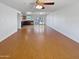 Bright and airy living room with hardwood floors and a view of the open kitchen and dining area at 3702 E Karen Dr, Phoenix, AZ 85032
