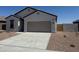 Charming single-story home featuring a spacious driveway and low-maintenance desert landscaping at 3945 E San Jose St, San Tan Valley, AZ 85143