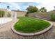 This backyard features a lush green lawn and mature foliage at 4038 E Wescott Dr, Phoenix, AZ 85050