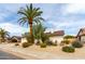 Charming single-story home featuring a well-maintained desert landscape and mature trees at 4038 E Wescott Dr, Phoenix, AZ 85050
