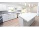 Modern kitchen featuring white cabinets, an island with stone accents, and stainless steel appliances at 4038 E Wescott Dr, Phoenix, AZ 85050