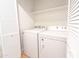 This laundry room features modern machines and custom storage options at 4038 E Wescott Dr, Phoenix, AZ 85050