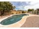 Backyard pool with easy access surrounded by a concrete patio and low maintenance landscaping at 4038 E Wescott Dr, Phoenix, AZ 85050