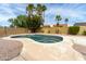 A backyard pool area enclosed by privacy walls and landscaped with gravel and palm trees at 4038 E Wescott Dr, Phoenix, AZ 85050