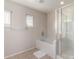 Bathroom showcasing a tub and separate shower at 43724 W Cowpath Rd, Maricopa, AZ 85138