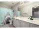 Bathroom featuring a wide mirror, shower, and cabinet at 43724 W Cowpath Rd, Maricopa, AZ 85138