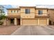Inviting two-story home with a spacious three-car garage and well-maintained desert landscaping at 43724 W Cowpath Rd, Maricopa, AZ 85138