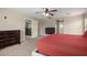 Spacious main bedroom with neutral carpet, ceiling fan, and lots of light at 43724 W Cowpath Rd, Maricopa, AZ 85138