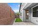 Private backyard featuring a patio, artificial turf, and a view of the surrounding landscape at 4383 N 203Rd Dr, Buckeye, AZ 85396