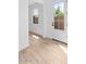Bright entryway featuring wood-look tile flooring and a large glass door offering natural light at 4383 N 203Rd Dr, Buckeye, AZ 85396
