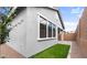 Charming exterior of a home featuring a well maintained yard and a modern, neutral color scheme at 4383 N 203Rd Dr, Buckeye, AZ 85396