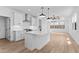 Open kitchen with a large island, stainless steel appliances, and an open floorplan at 4383 N 203Rd Dr, Buckeye, AZ 85396