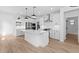 Modern kitchen featuring a center island with quartz countertops and stainless steel appliances at 4383 N 203Rd Dr, Buckeye, AZ 85396