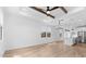 Spacious living room showcases wood-look floors and modern lighting fixtures at 4383 N 203Rd Dr, Buckeye, AZ 85396