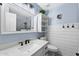 Modern bathroom with board and batten accents, framed mirror and updated sink at 4407 E Meadow West Ln, Queen Creek, AZ 85140