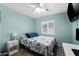 Comfortable bedroom featuring a twin bed, natural light, and space-saving furniture at 4407 E Meadow West Ln, Queen Creek, AZ 85140