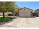 Charming single-Gathering home featuring a well-manicured front yard, two-car garage, and inviting curb appeal at 4407 E Meadow West Ln, Queen Creek, AZ 85140