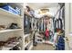 Walk-in closet with shelving and hanging storage for organization at 4415 W Ellis St, Laveen, AZ 85339