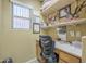 Close-up of built-in desk area with shelves, featuring desk accessories and certificates at 4415 W Ellis St, Laveen, AZ 85339