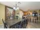 Dining area with an eye-catching piece of art and view of the kitchen at 4415 W Ellis St, Laveen, AZ 85339