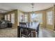 Dining area with backyard views and a seamless transition to the living room at 4415 W Ellis St, Laveen, AZ 85339
