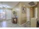 Bright entryway with tile flooring, decorative table, and view into the living area at 4415 W Ellis St, Laveen, AZ 85339
