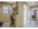 Hallway featuring a built-in desk area with shelves and access to the bathroom at 4415 W Ellis St, Laveen, AZ 85339