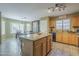 Open eat-in kitchen featuring granite countertops and a view to the dining area at 4415 W Ellis St, Laveen, AZ 85339