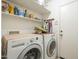 Laundry room with shelving and a side-by-side washer and dryer at 4415 W Ellis St, Laveen, AZ 85339