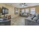 Cozy living room featuring a TV, comfortable seating, and neutral color palette at 4415 W Ellis St, Laveen, AZ 85339