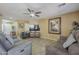Spacious living room with tile flooring, ceiling fan, and comfortable seating arrangement at 4415 W Ellis St, Laveen, AZ 85339