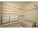 Walk-in closet featuring custom storage solutions including shelving and drawers at 5641 E Grovers Ave, Scottsdale, AZ 85254