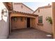 Private courtyard featuring a covered entry, brick paving, and a welcoming ambiance at 5641 E Grovers Ave, Scottsdale, AZ 85254