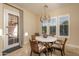 Bright breakfast nook with lots of natural light coming in from large window at 5641 E Grovers Ave, Scottsdale, AZ 85254