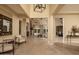 Grand foyer with travertine floors leads to inviting living spaces at 5641 E Grovers Ave, Scottsdale, AZ 85254