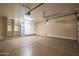 Spacious garage with epoxy floor, built-in storage, and mini-fridge for convenience at 5641 E Grovers Ave, Scottsdale, AZ 85254