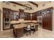 Chef's kitchen with a spacious island, custom cabinetry and stainless steel appliances at 5641 E Grovers Ave, Scottsdale, AZ 85254