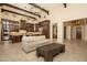 Bright and airy living room with open kitchen, stone flooring, and a comfortable seating area at 5641 E Grovers Ave, Scottsdale, AZ 85254