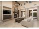 Inviting living room with a cozy fireplace and stone surround at 5641 E Grovers Ave, Scottsdale, AZ 85254