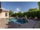 Backyard features an in-ground pool, spa, and mature landscaping at 5641 E Grovers Ave, Scottsdale, AZ 85254